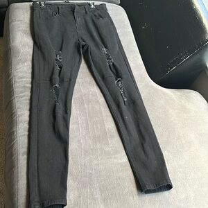 Mean all black ripped skinny jeans